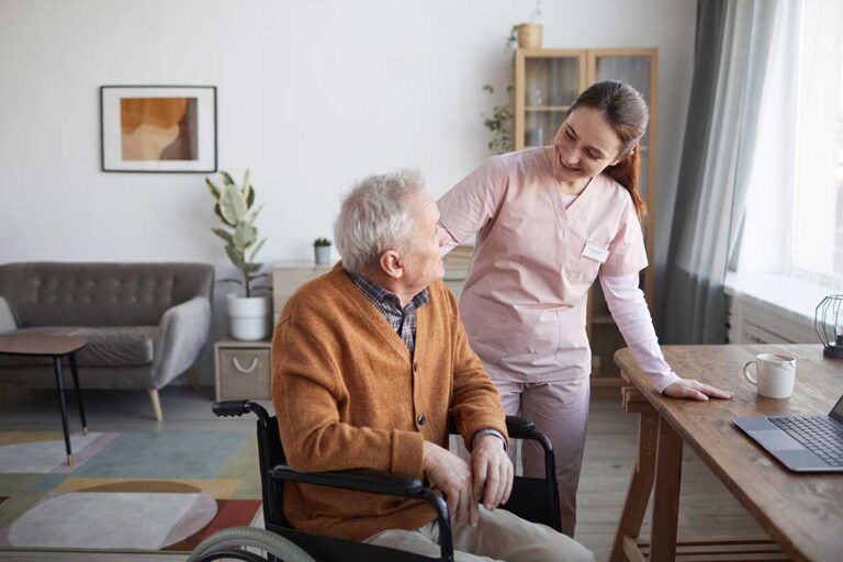 An older adult chatting with family members on a video call in a comfortable living room.